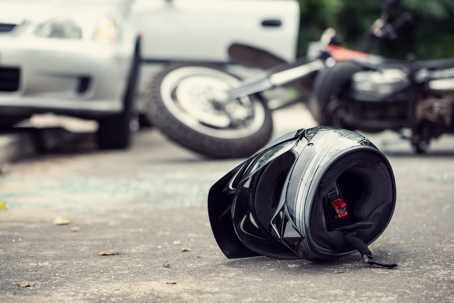 Aftermath of a motorcycle accident involving a car